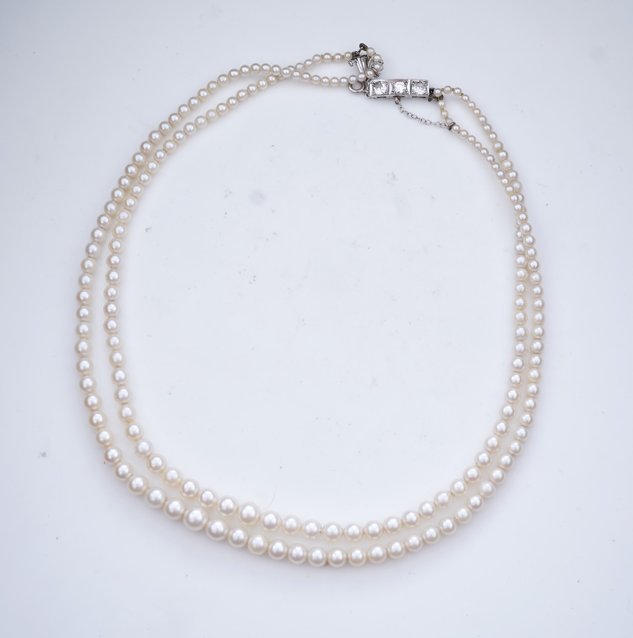 A cultured pearl and diamond necklace, early 20th century